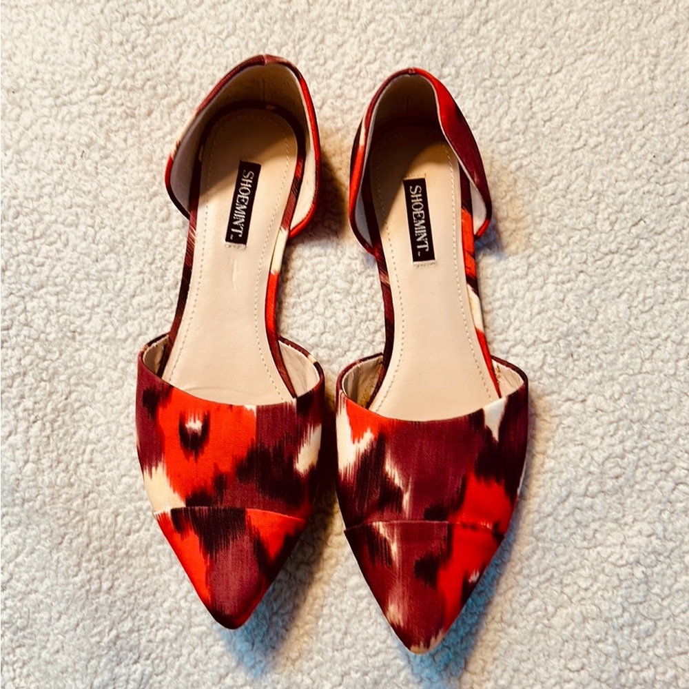 Shoemint Audrey pointed-toe flats in a red, black, cream ikat fabric pattern.